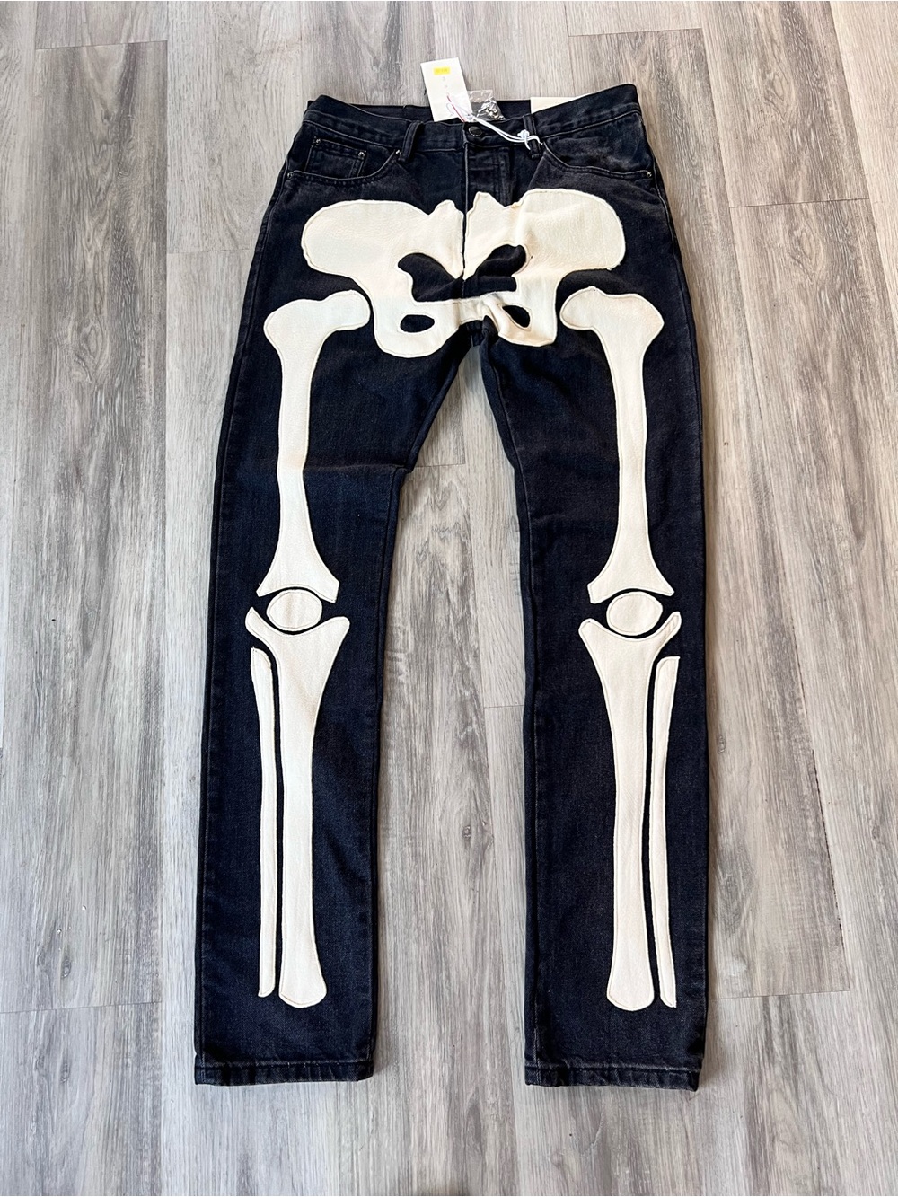 MNML D184 Skeleton Denim Pants With Bone Appliqués Down The Front Legs.